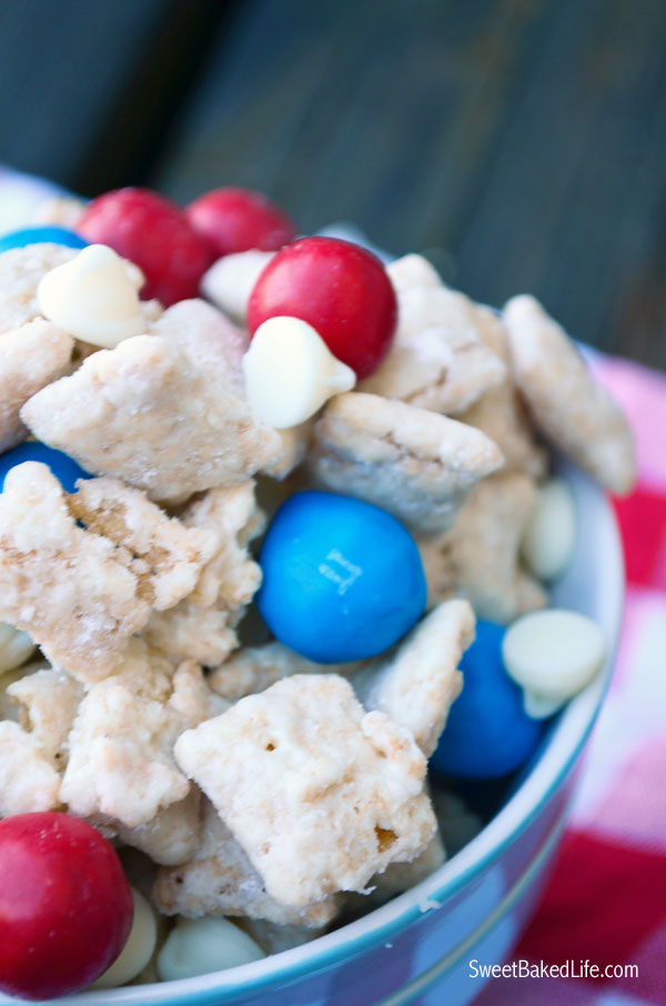 Patriotic Puppy Chow -- chex cereal coated with cake mix and sprinkled with red, white and blue candy. | Sweet Baked Life