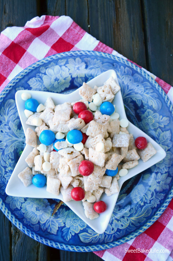 Patriotic Puppy Chow -- chex cereal coated with cake mix and sprinkled with red, white and blue candy. | Sweet Baked Life