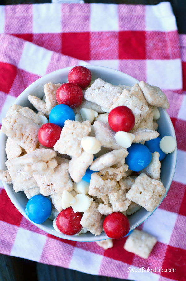 Patriotic Puppy Chow -- chex cereal coated with cake mix and sprinkled with red, white and blue candy. | Sweet Baked Life