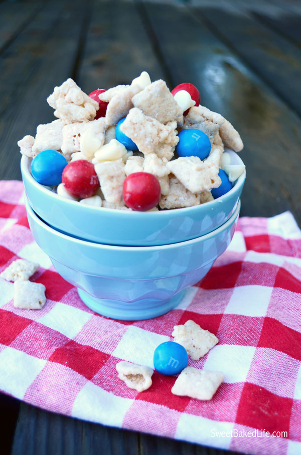 Patriotic Puppy Chow -- chex cereal coated with cake mix and sprinkled with red, white and blue candy. | Sweet Baked Life