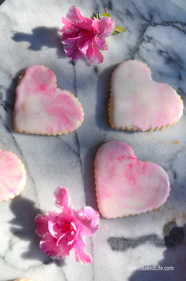 Pretty and delicious - pink glazed heart shortbread cookies | @sweetbakedlife.com