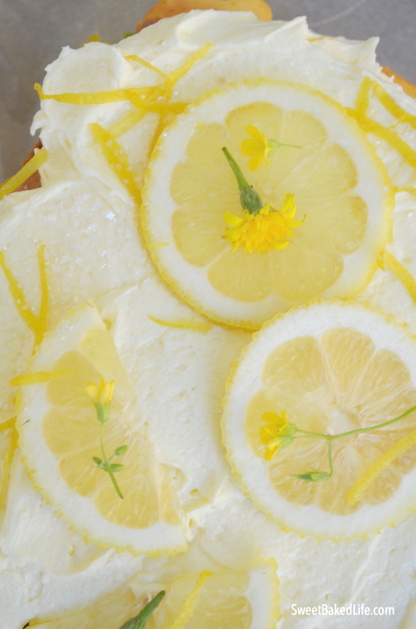 Lemon Raspberry Cake with tangy lemon buttercream frosting! @sweetbakedlife.com